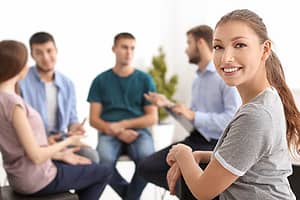 a group of people attend group therapy during evening intensive outpatient program in tampa