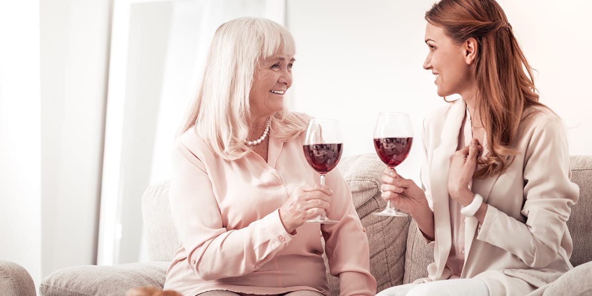 two women drinking ignoring Wine Mom Culture