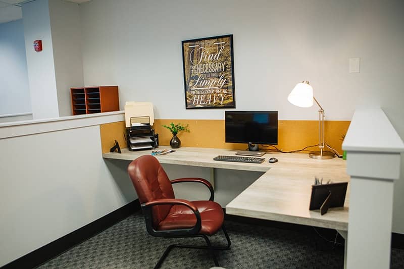 L-shaped desk in an open office setting at Bayview Recovery Center
