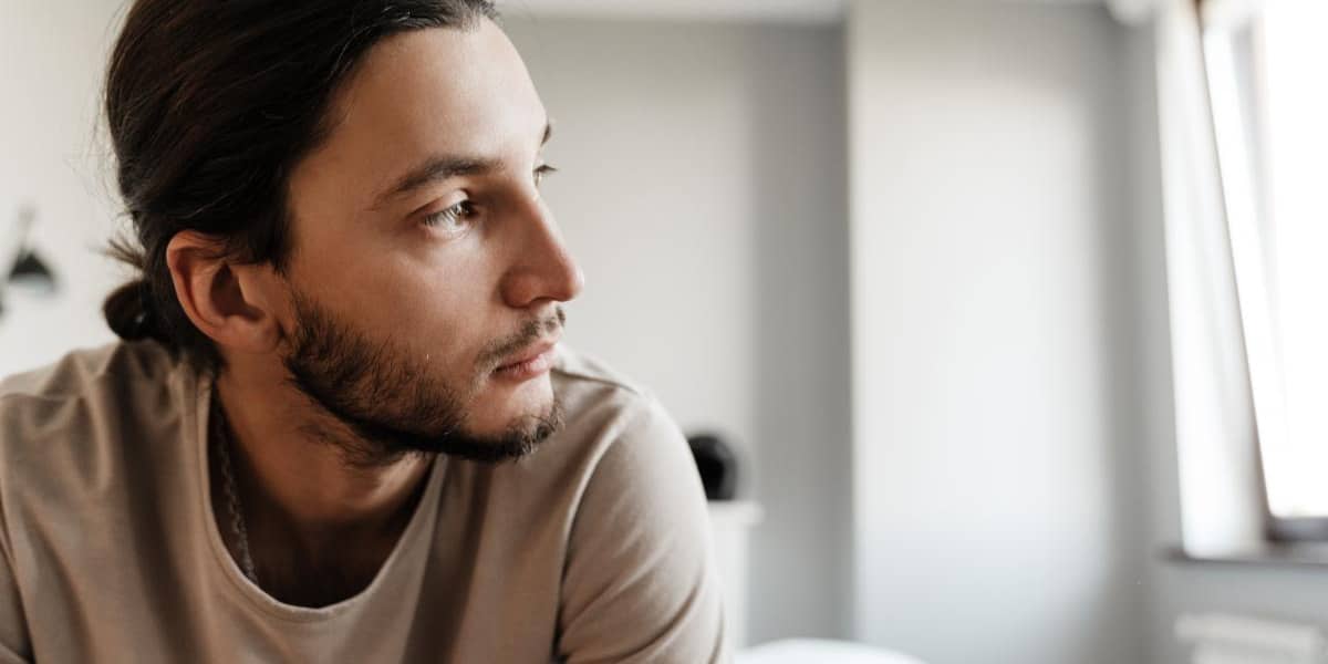 man sitting thinking about how depression is often untreated