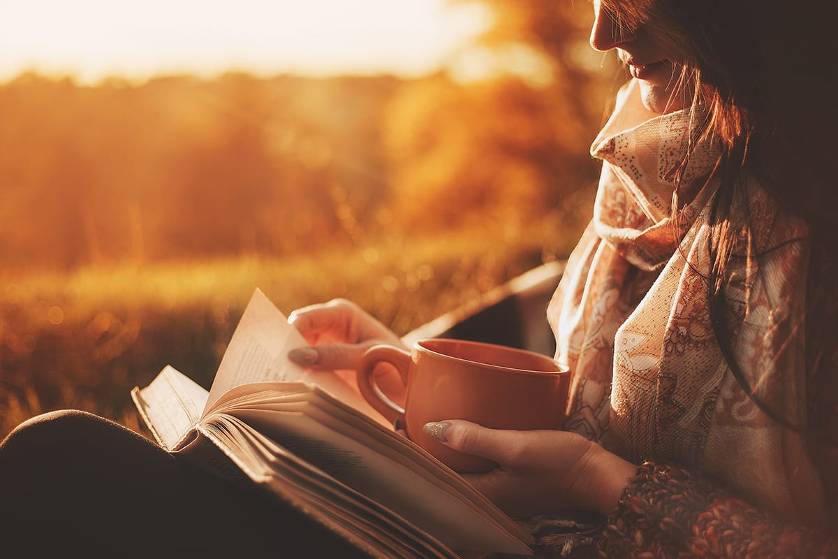 a woman reading as a way of coping with loneliness