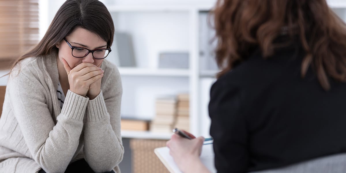 a woman talking to her doctor about acute stress disorder