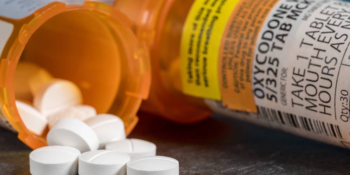 a pile of pills with an update on the opioid epidemic 2020