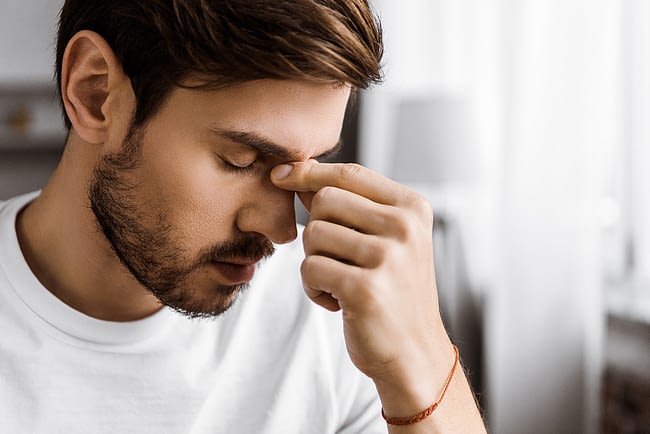 Man struggling due to imbalances caused by alcohol and dopamine