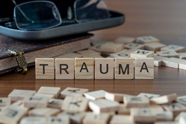 Scrabble letters showing trauma and substance abuse
