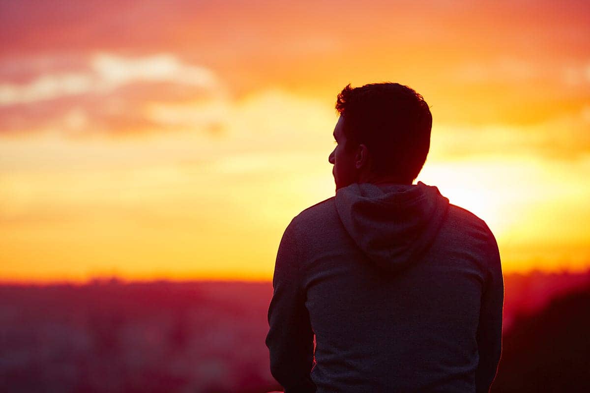 a man looking at the sunset thinking about his relapse prevention guide