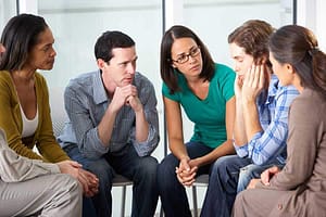 group therapy session at a center for addiction treatment