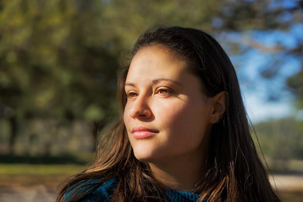 woman with sunlight on face learning cbt techniques for addiction recovery