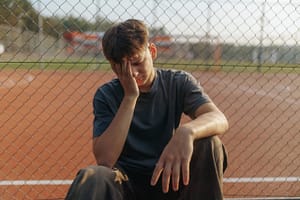 Depressed teen feels the effects of gateway drugs and needs mental health therapy for teenage boys.