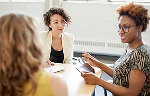 Woman talks to therapists about referring a professional