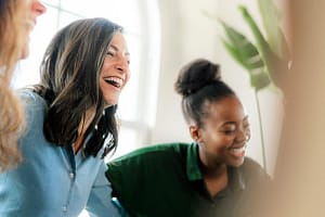 Women in rehab alumni program laugh and bond