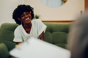 Woman smiles while talking about coping skills