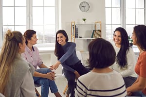 Women gather in a group at an anxiety treatment center for women