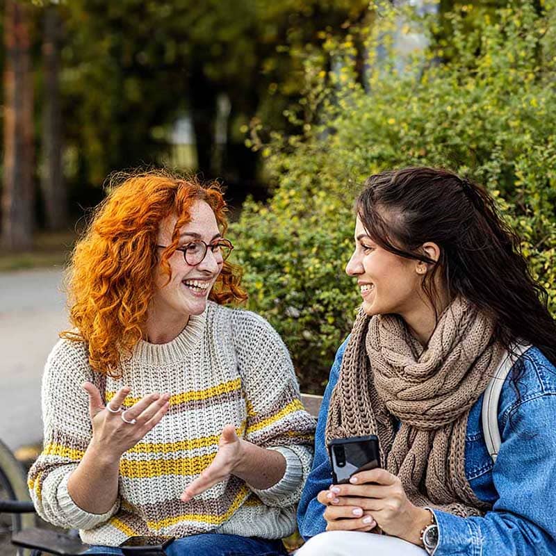 Two women discuss admissoins for a loved one