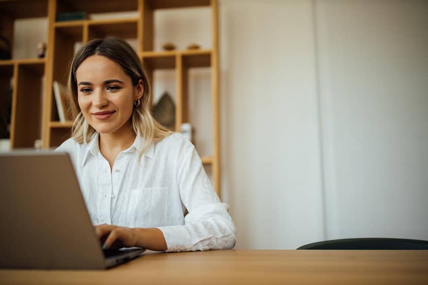 Functioning alcoholic sits at computer and woris