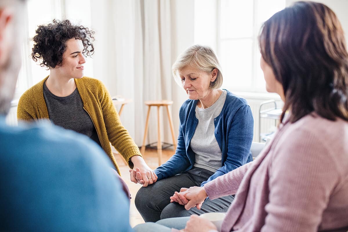 people participating in group therapy in drug rehab