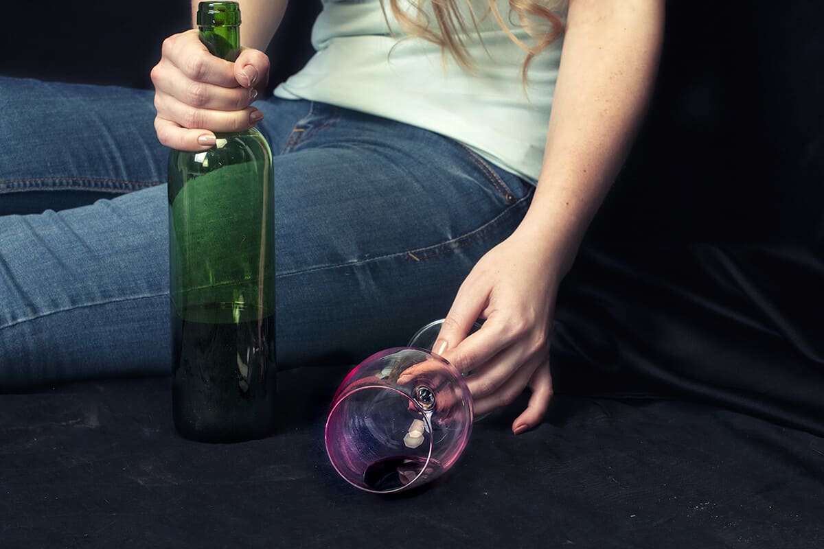 woman showing connection between women and alcoholism