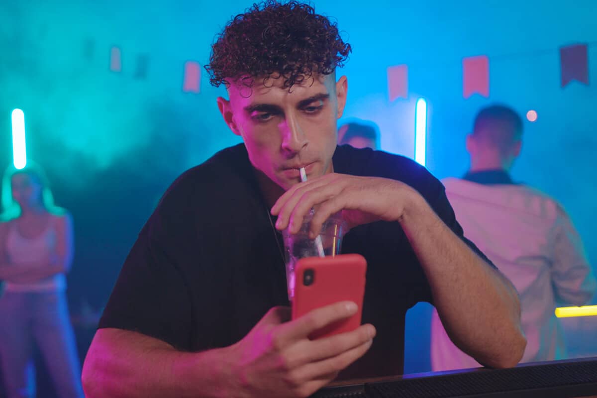 man thinking about the connection between drinking and social media