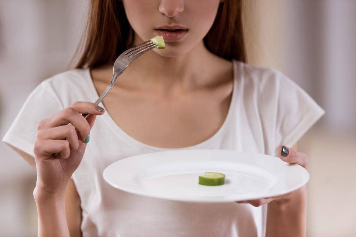 A young woman exhibiting signs of anorexia