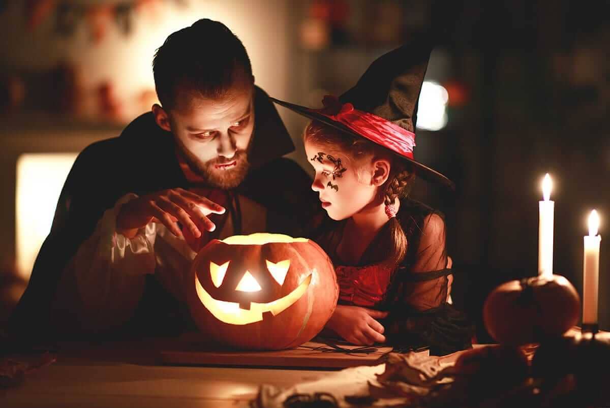 man celebrates sober halloween with his daughter