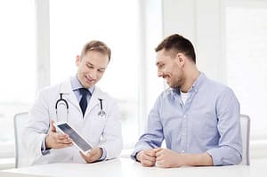 man talking to doctor about detox centers
