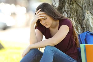woman with headache has uncomfortable detox symptoms