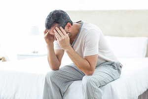 man with headache has psychological dependence
