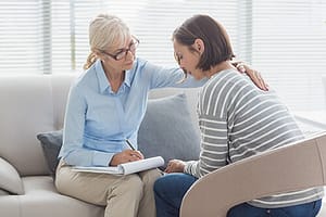 woman talks to therapist about Help for Alcoholics
