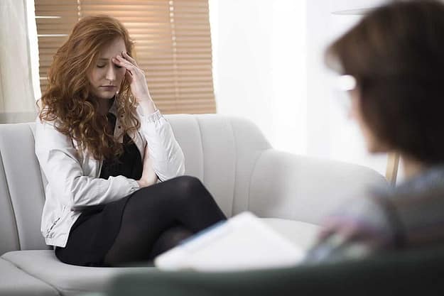 woman talking to intake counselor wondering what is rehab like