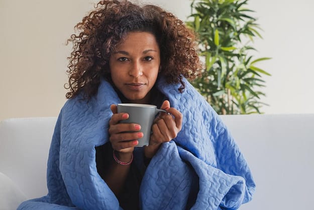 woman in blanket going through speed withdrawal symptoms