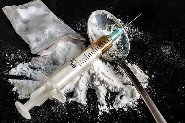 A needle and spoonful of heroin beg the question is heroin a narcotic