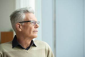 Man looking in the distance wondering about mdma withdrawal timeline for his daughter