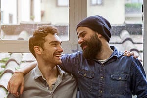 two men joyful in recovery at the men's detox center