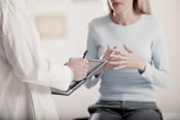 drug rehab health insurance - woman talking to doc, no faces