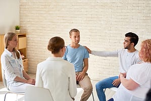 group of people discusses What Is Rehab