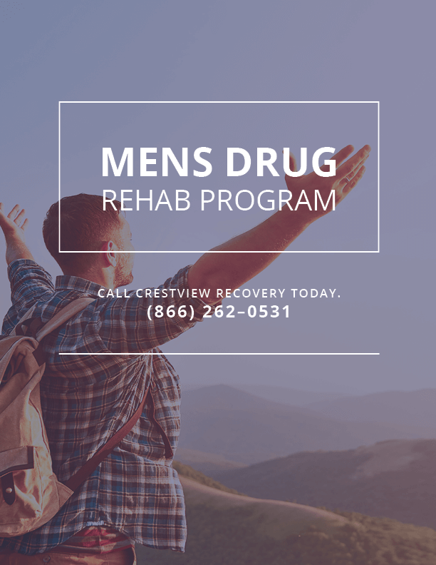 a man raises his hands to the sky at a men's drug rehab program
