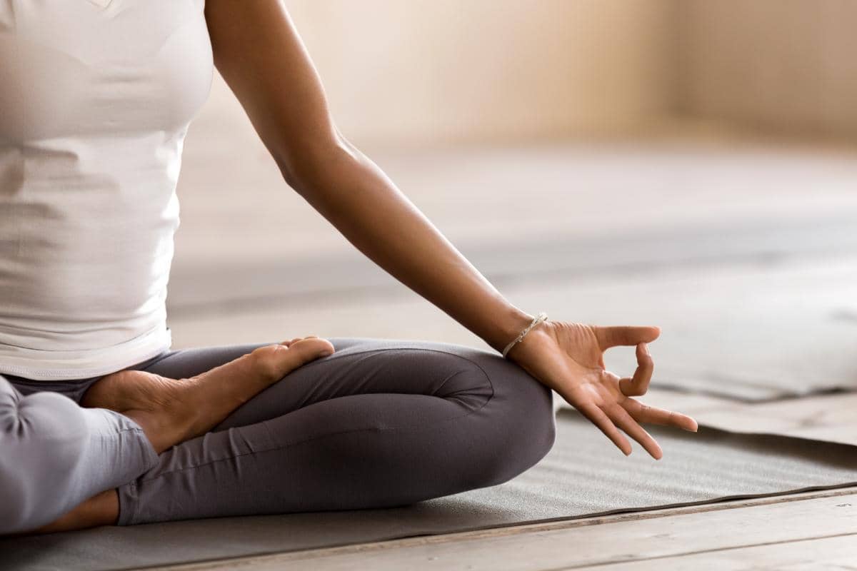 woman practicing yoga therapy in addiction treatment