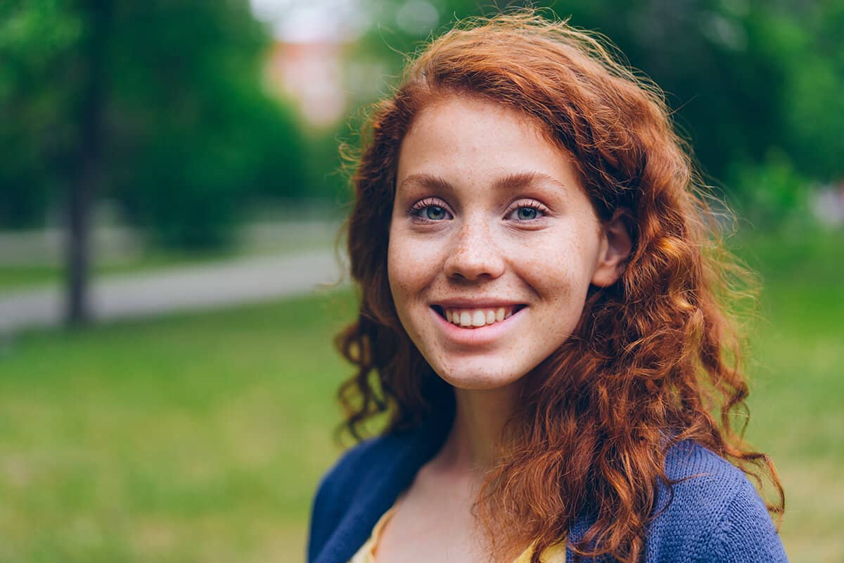 woman smiling wondering how to achieve drug recovery