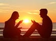 couple sitting during sunset one has a heroin addiction