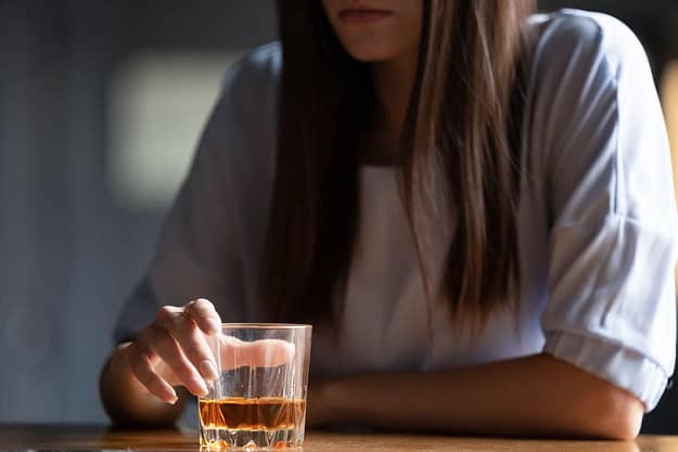 a woman displaying alcohol abuse signs