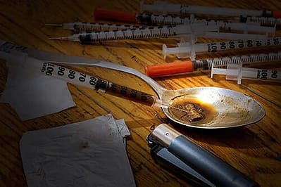 black tar heroin on a wooden table