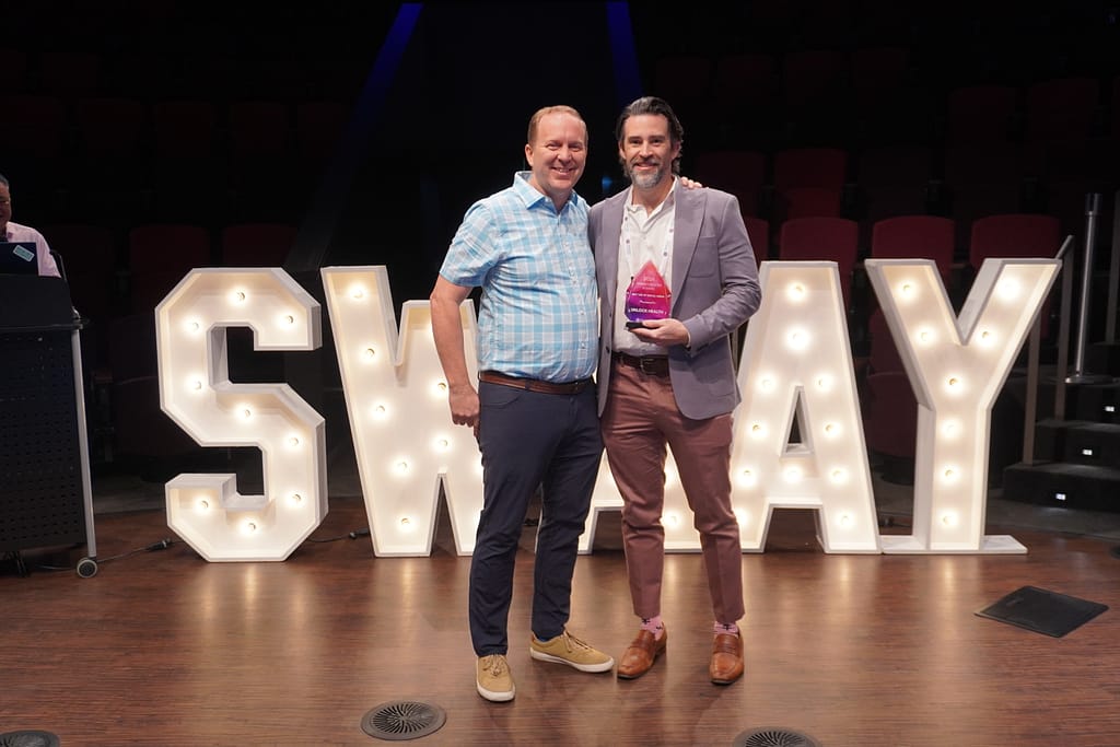Larry Williams accepting the Swaay.Health Live award for best use of social media