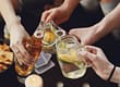 people raising drinks together need to know the difference between a social drinker and alcoholic