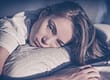 a woman in bed wondering can you die from cocaine withdrawal