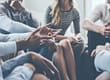 A group of people discuss dual diagnosis treatment programs