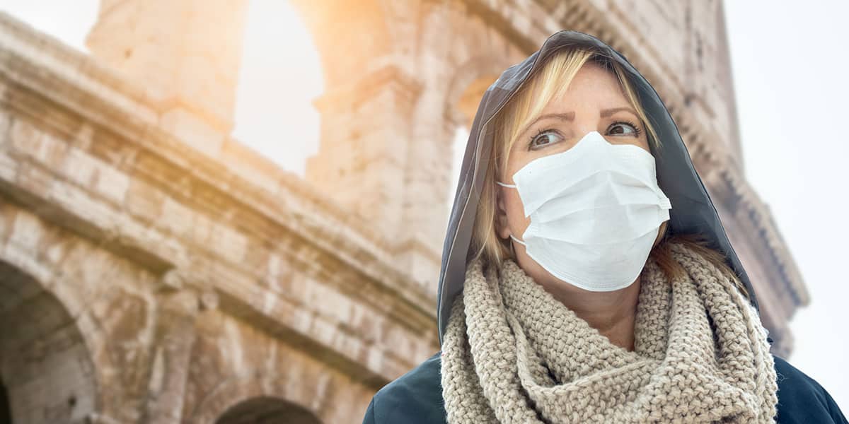 woman with a mask in public showing epidemic vs pandemic