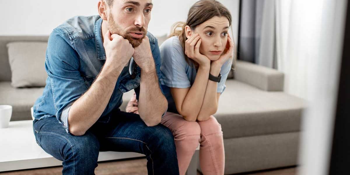 Man and woman sitting learning about unhealed trauma