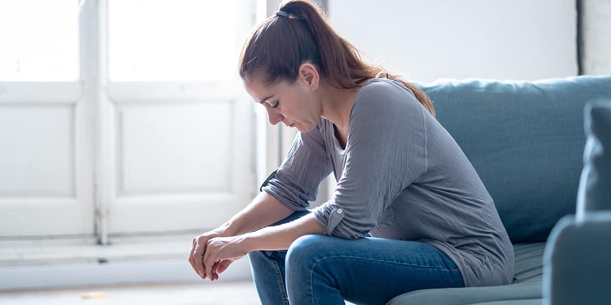 Upset woman wonders what happens when you stop drinking alcohol cold turkey