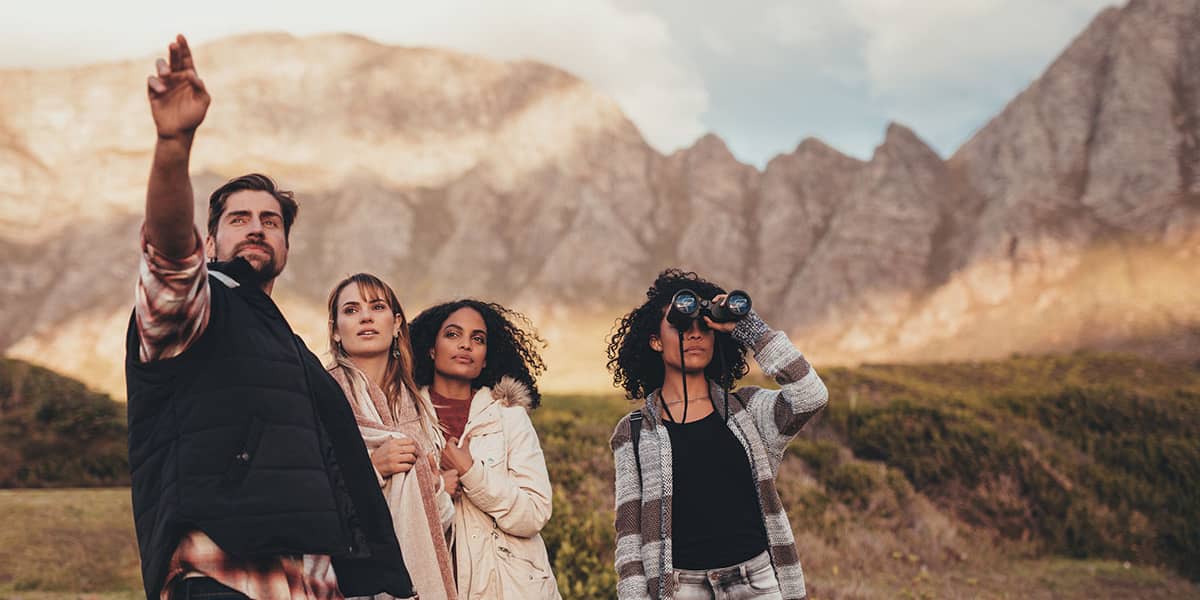 a group going on a hike in the mountains during Adventure Therapy