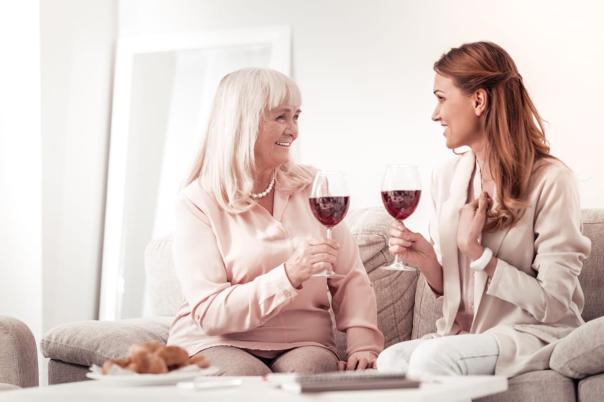 two women drinking ignoring Wine Mom Culture